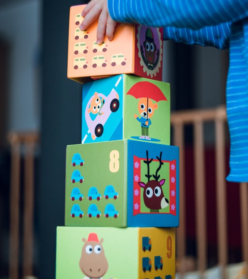 child building an four boxes